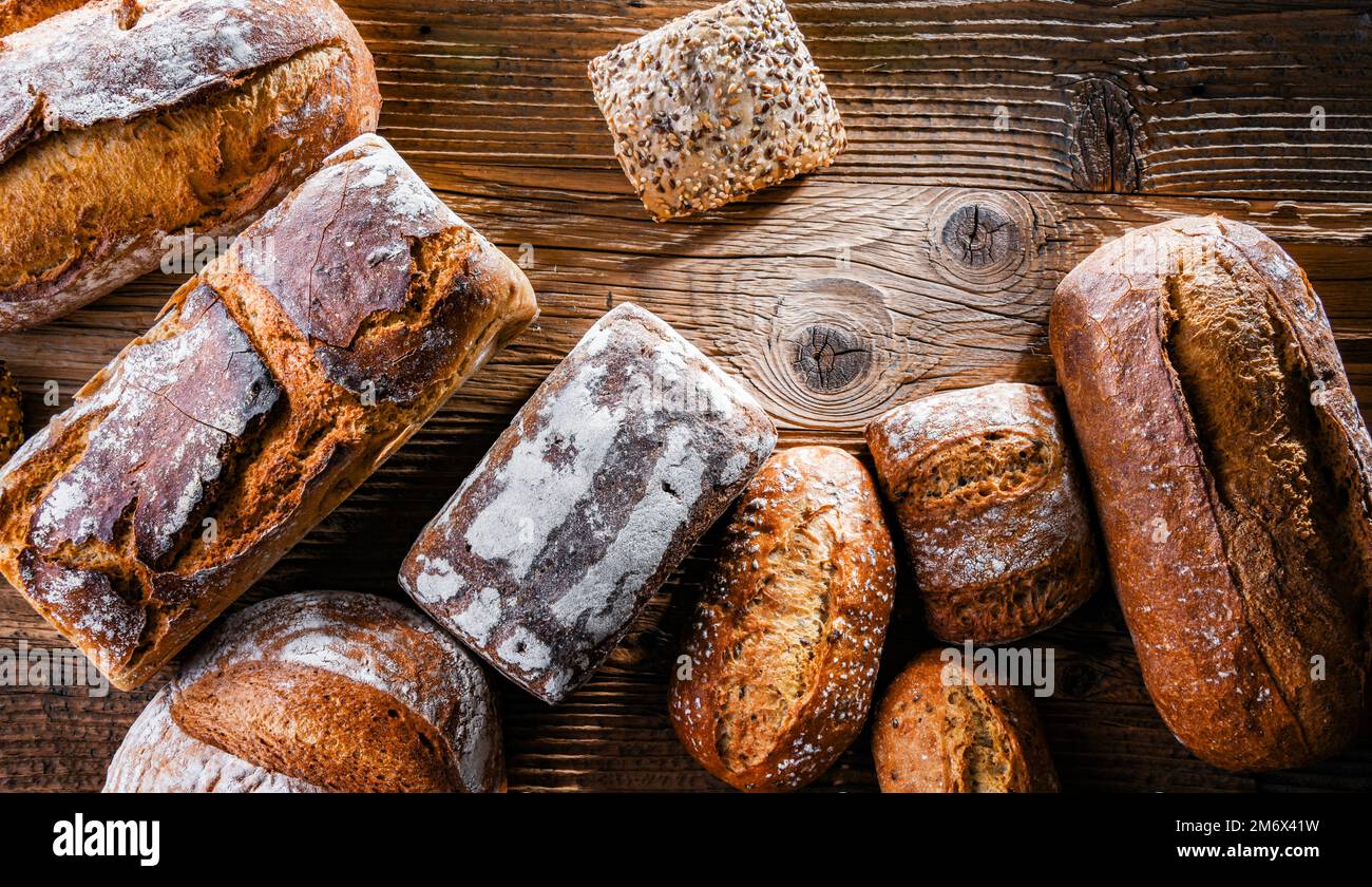 Composition with assorted bakery products on wooden table. Stock Photo