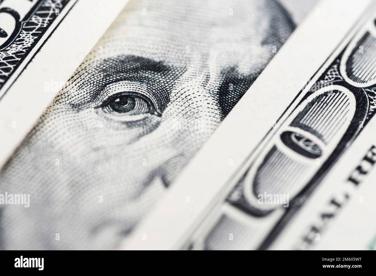 Benjamin Franklin's eyes from a hundred-dollar bill. 100 dollar bill ...