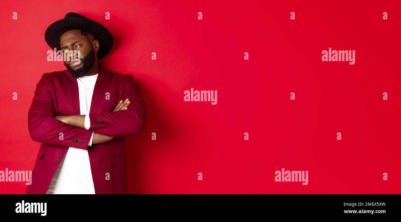 Red Offend Reluctant and upset african american man looking away, cross arms on ...