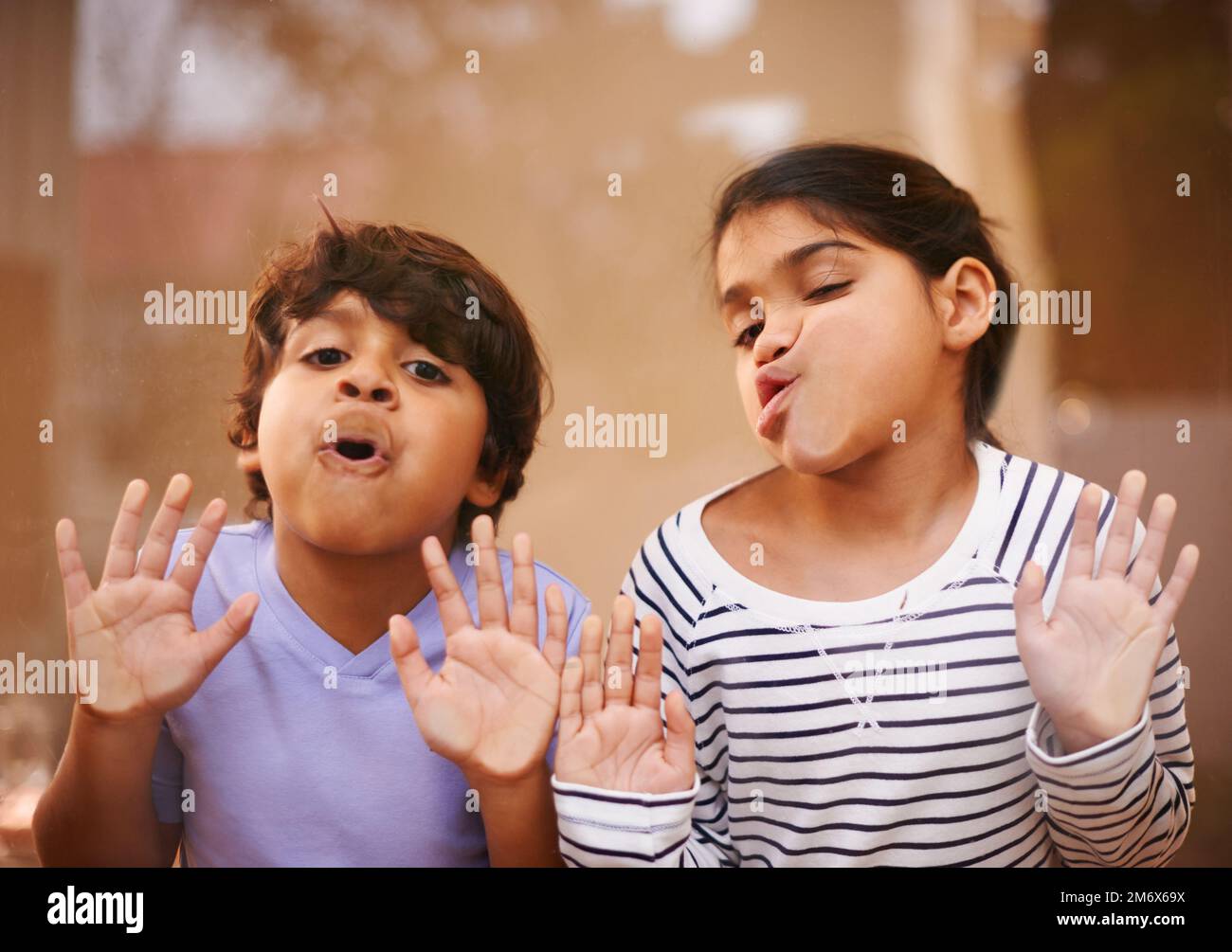 Goof balls. a cute brother and sister having fun together at home. Stock Photo