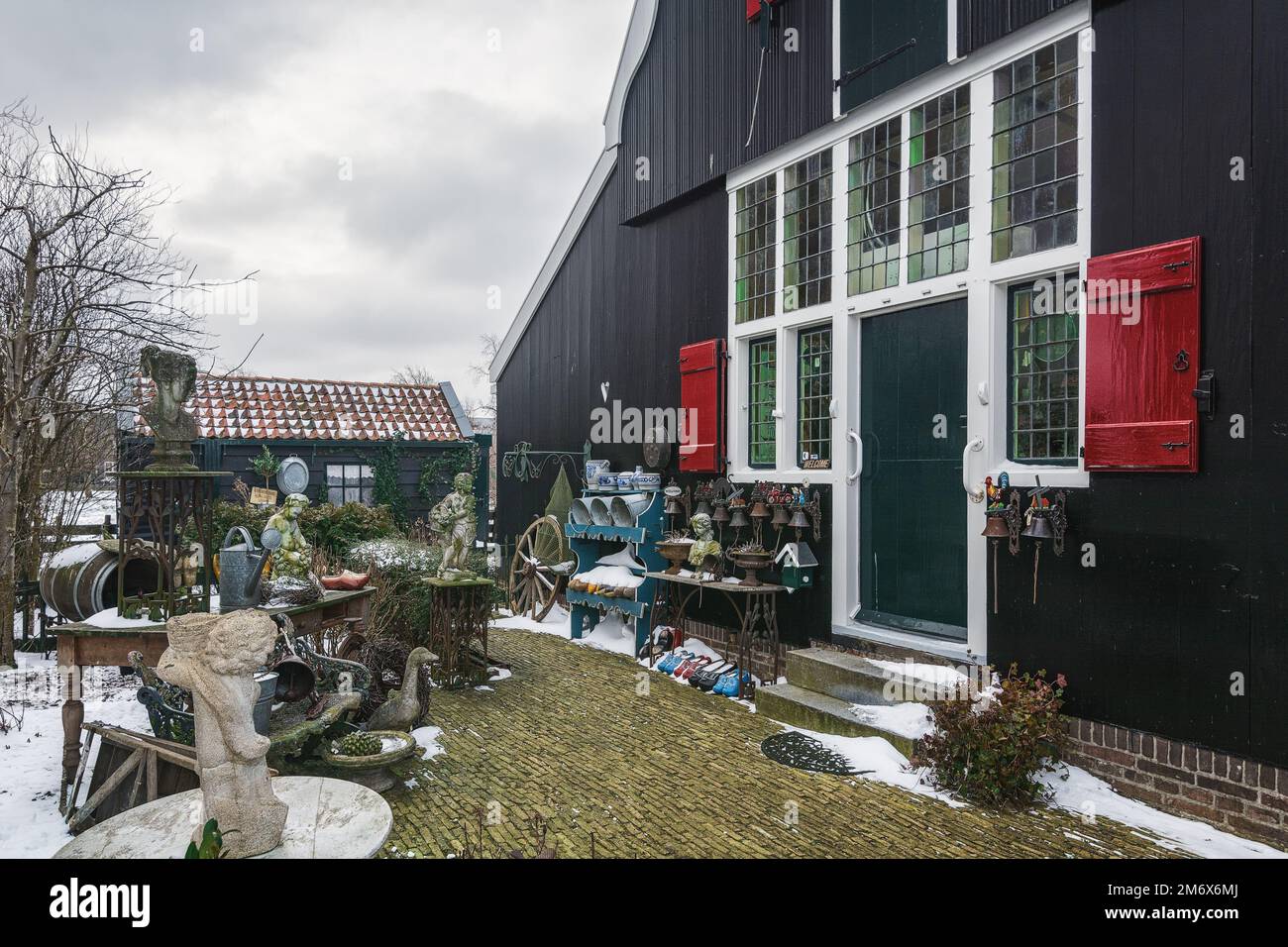 Zaandam, Netherlands, February 10, 2021: A small market for used, old garden decorations in the courtyard of the house. Stock Photo