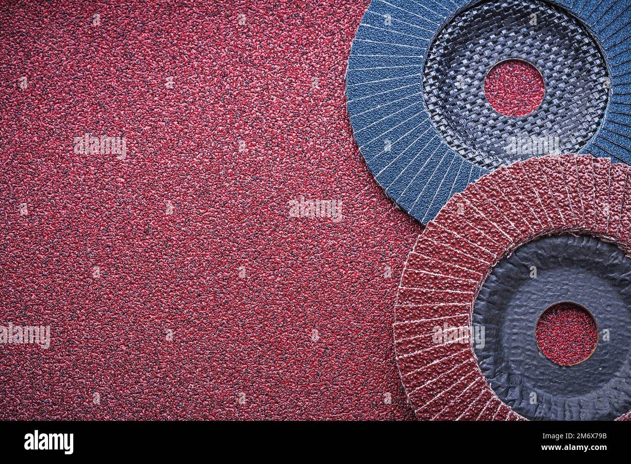 Abrasive flap wheels on emery paper top view Stock Photo Alamy