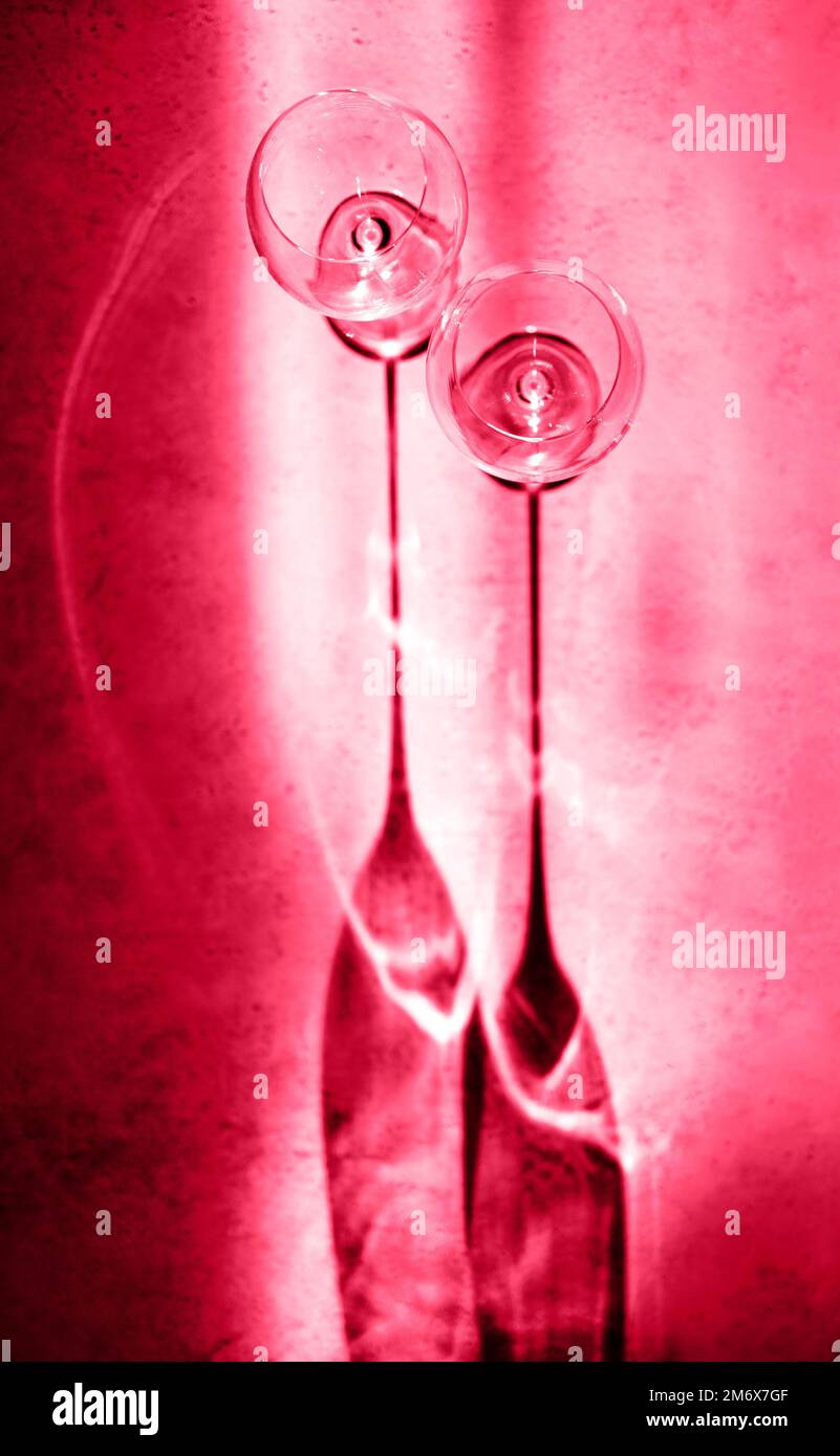 Empty wineglasses with silhouette on background with dark shadow top view Stock Photo