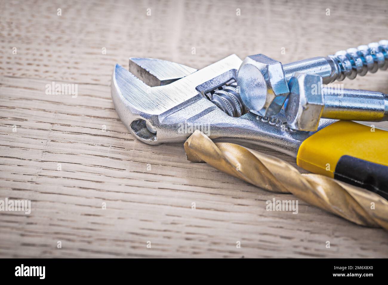 bolts adjustable wrench and drill Stock Photo Alamy