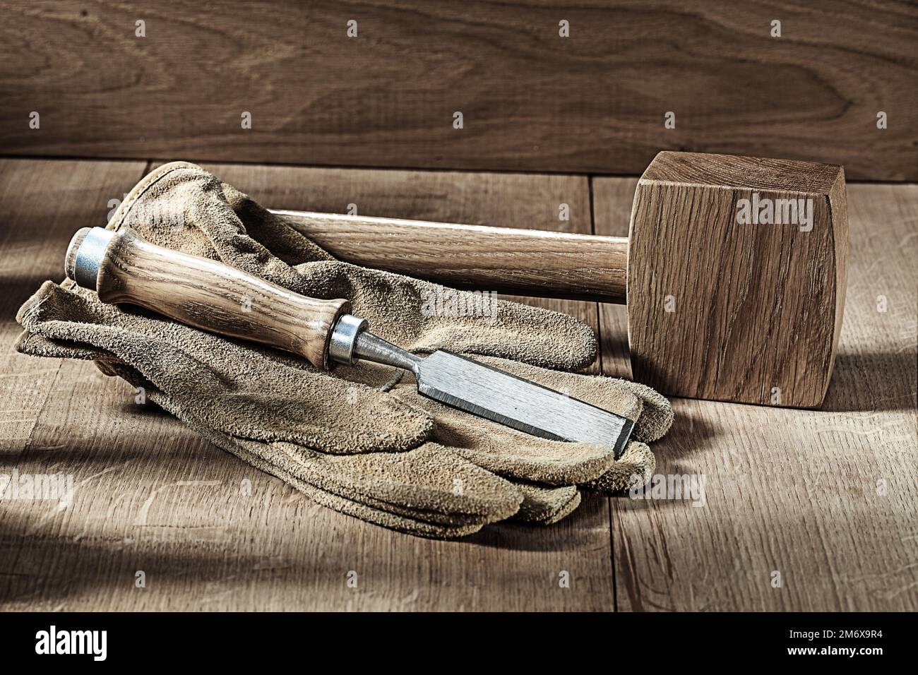 carpenter tools wooden mallet gloves and chisel Stock Photo - Alamy