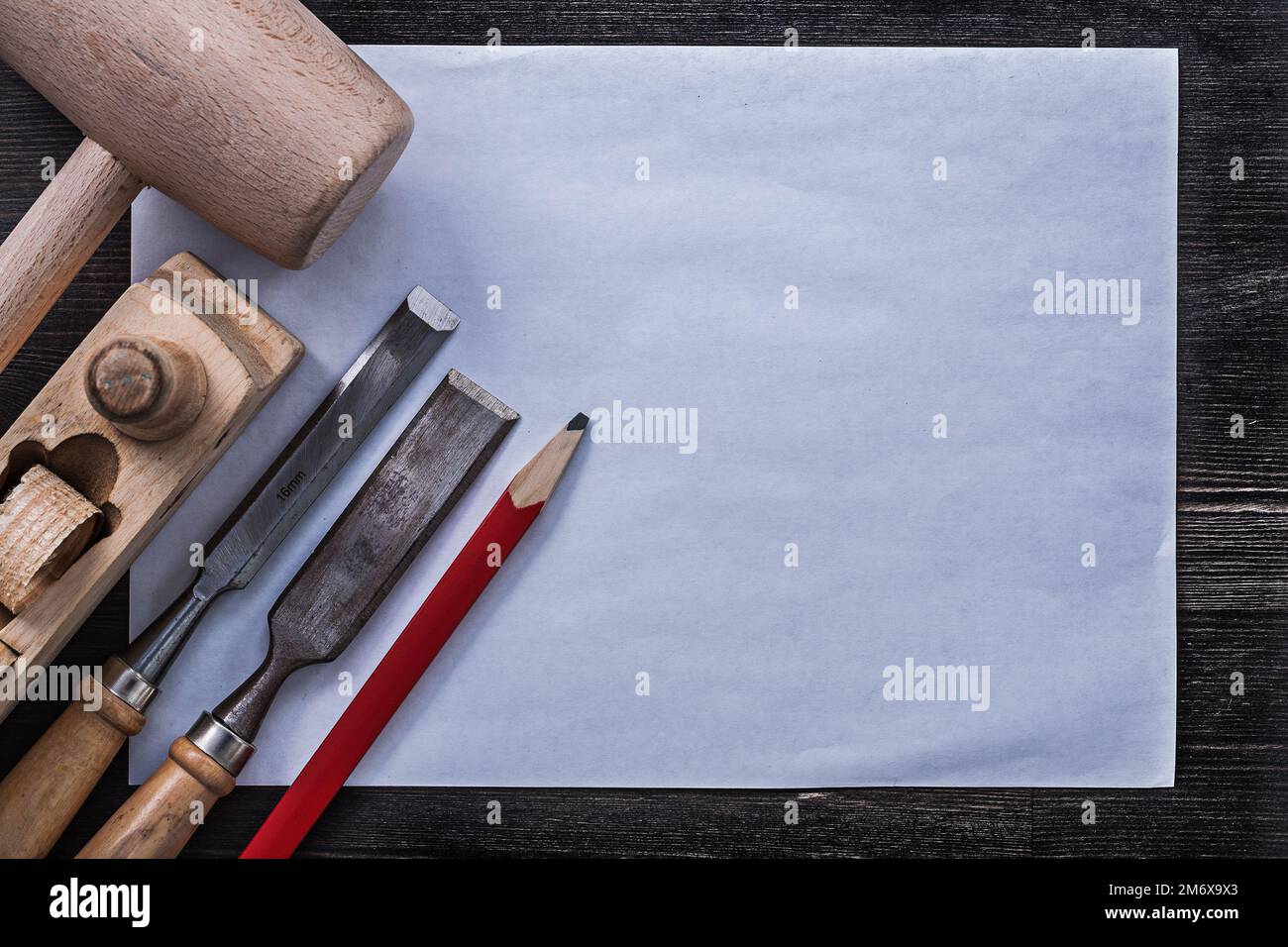 Chisels lump hammer shaving plane pencil clean paper construction concept. Stock Photo