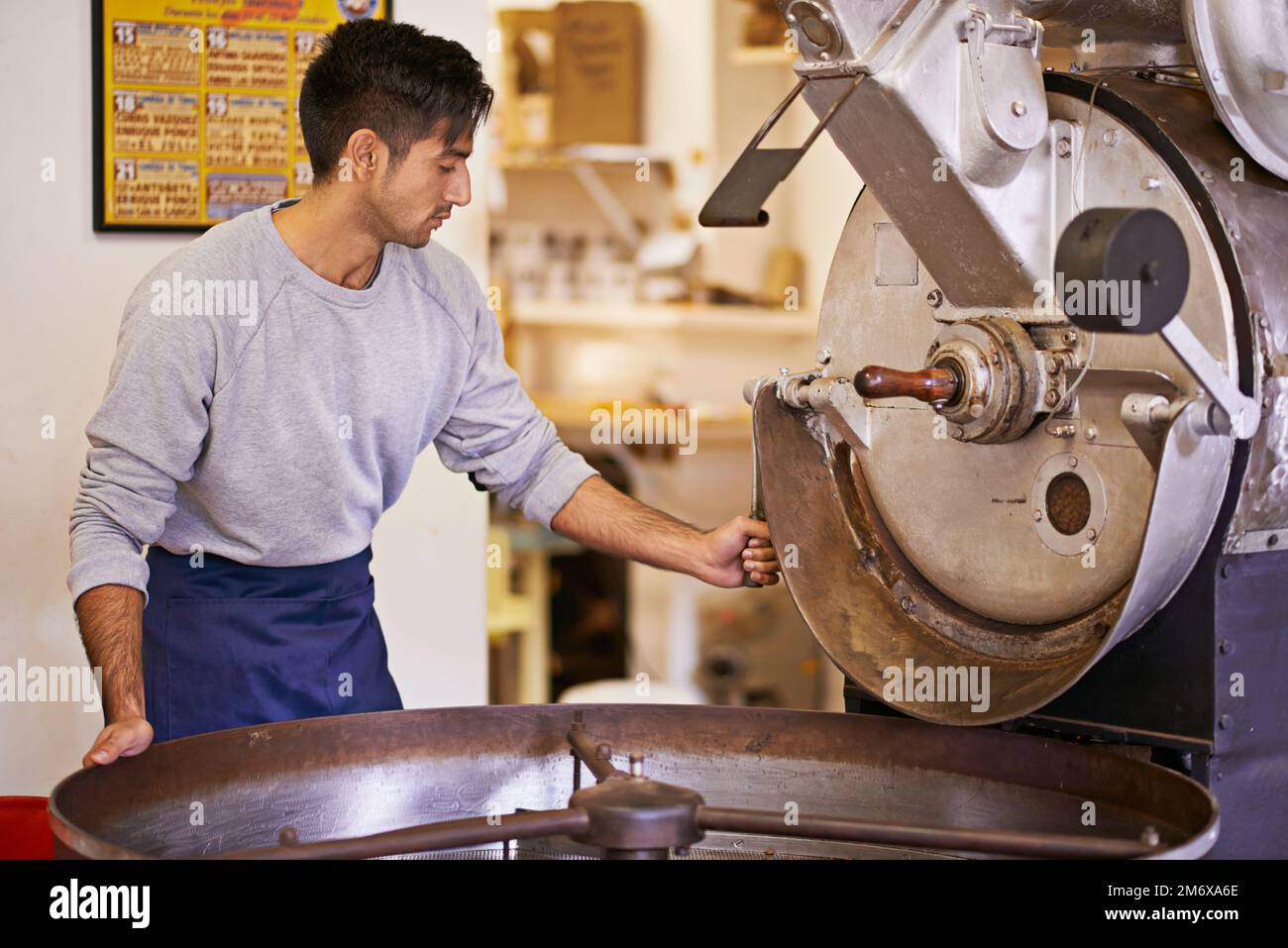 Ready to turn these into aromatic coffee. a machine grinding and