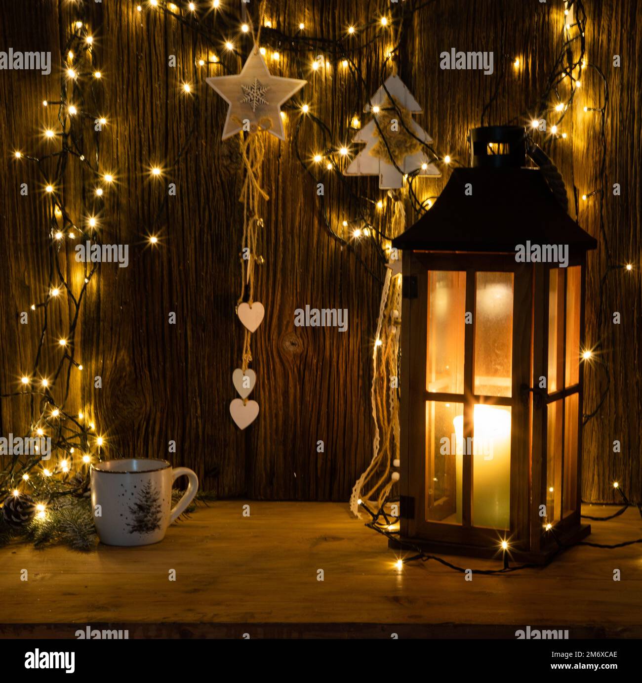 Christmas lights and decorations on wooden background Stock Photo - Alamy