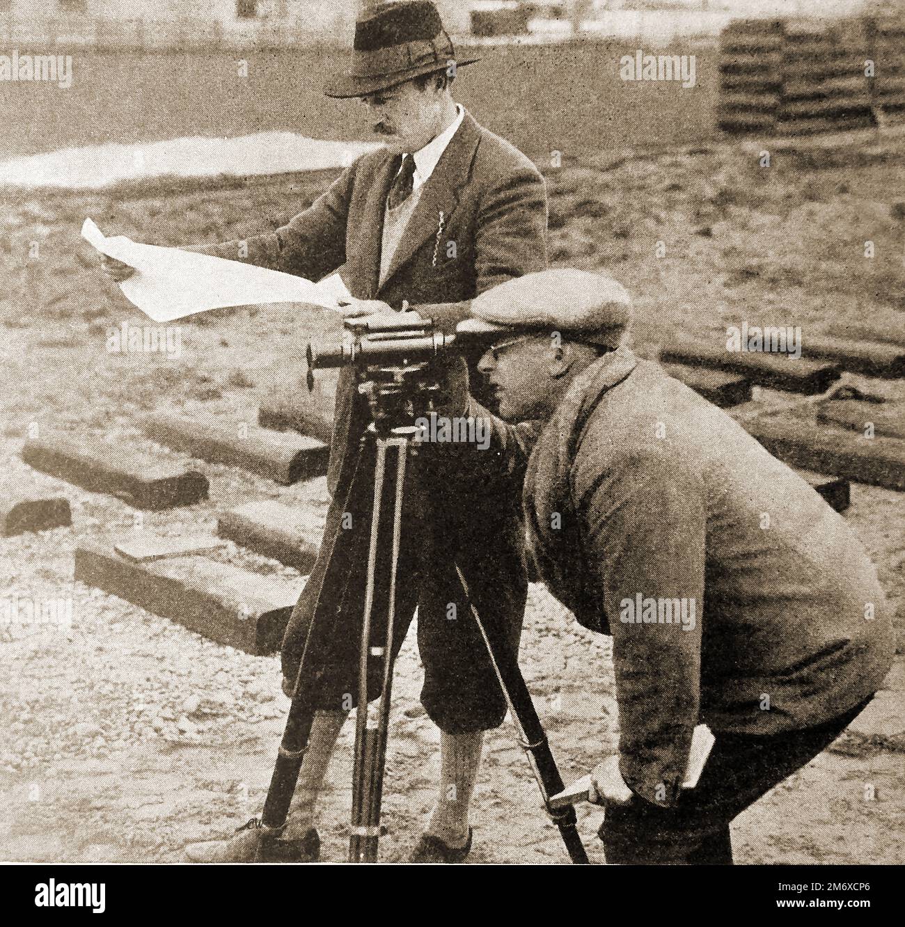 An early image of surveyors taking readings on the miniature Romney, Hythe & Dymchurch light railway.. The railway was the dream of millionaire racing drivers Captain John Edwards Presgrave ('Jack') Howey and Count Louis Zborowski.. The railway was opened on 16 July 1927 Stock Photo