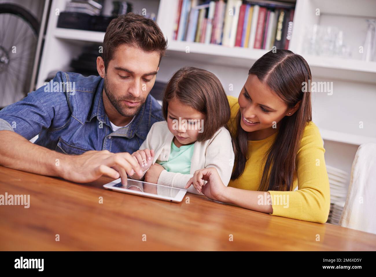 Technology makes learning fun. young parents showing their little