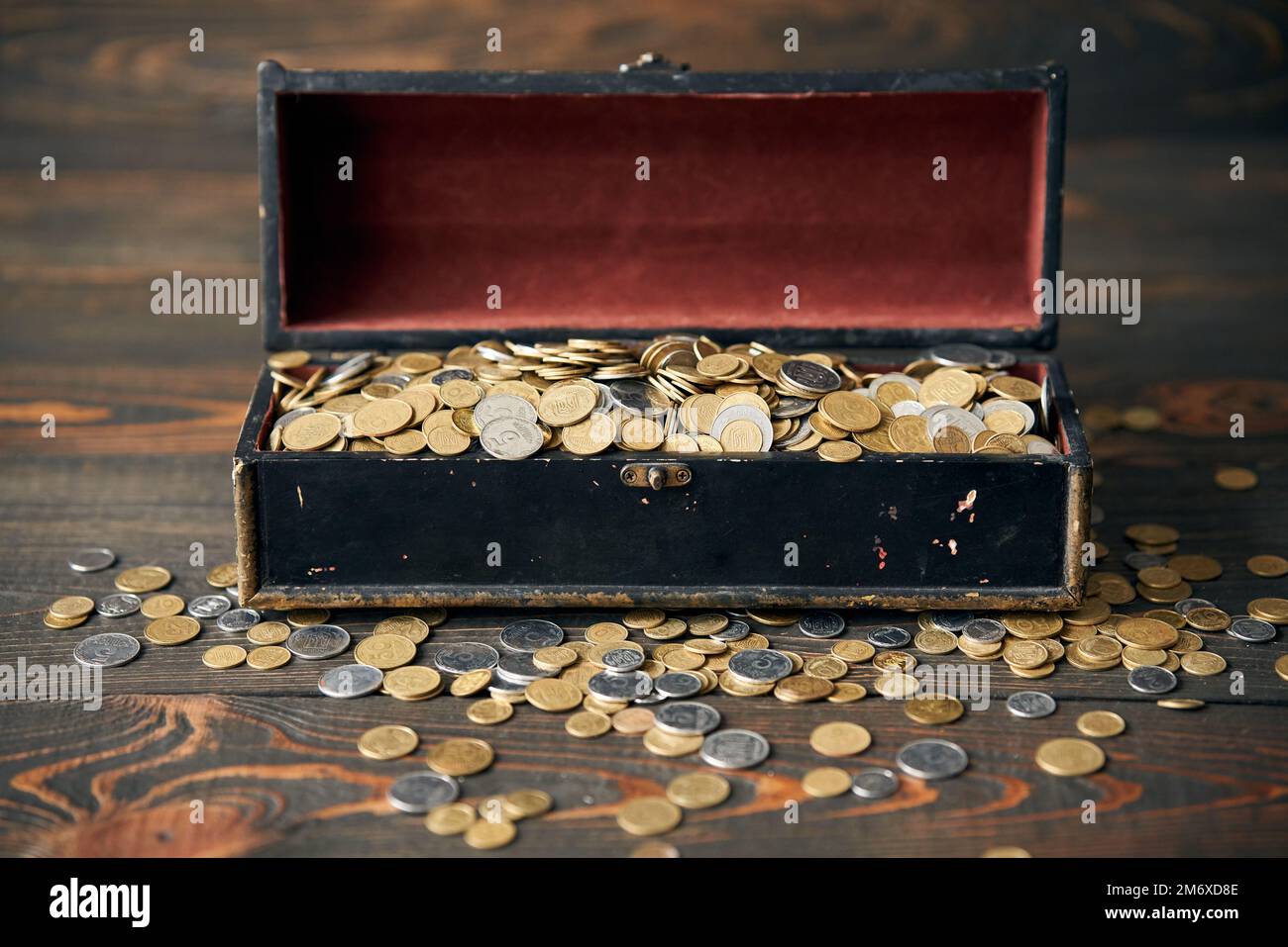 Large treasure of gold coins with overflowing open chest. Stock