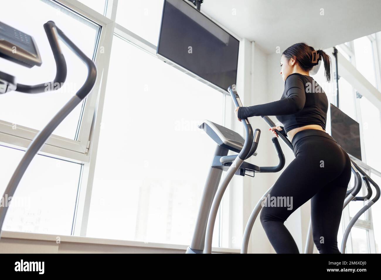 Doing cardio on the treadmill. Running on a treadmill. Stock Photo
