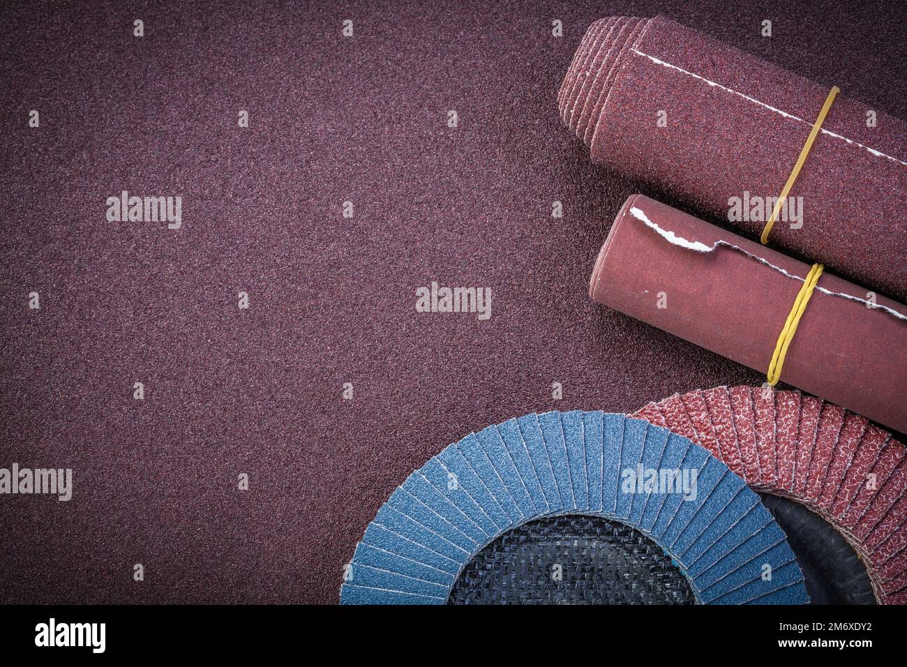 Emery paper flap grinding wheels on polishing sheet copy space Stock