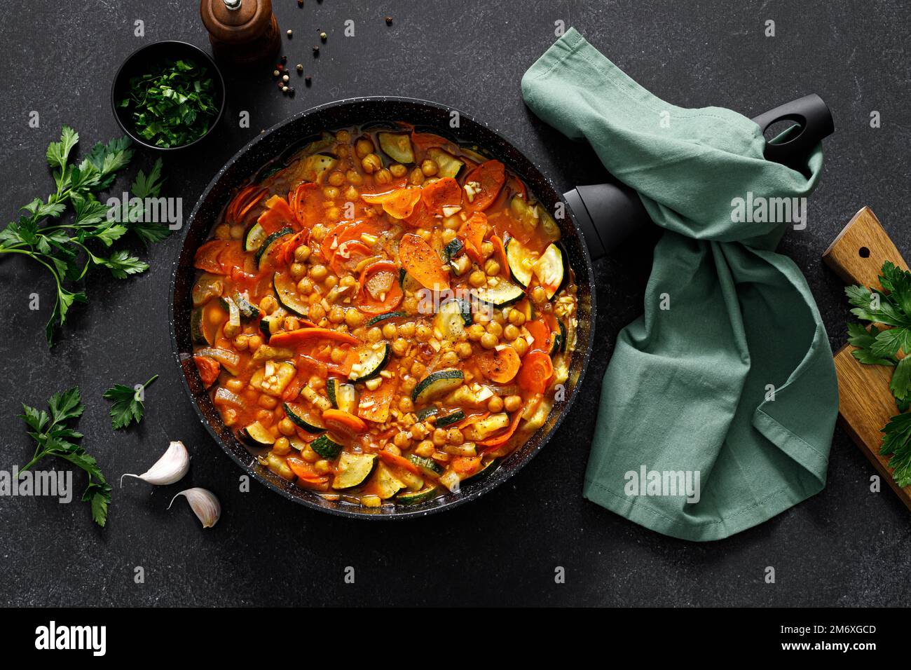 Chickpea and zucchini saute with carrot and garlic. Classic italian side dish. Top view Stock Photo