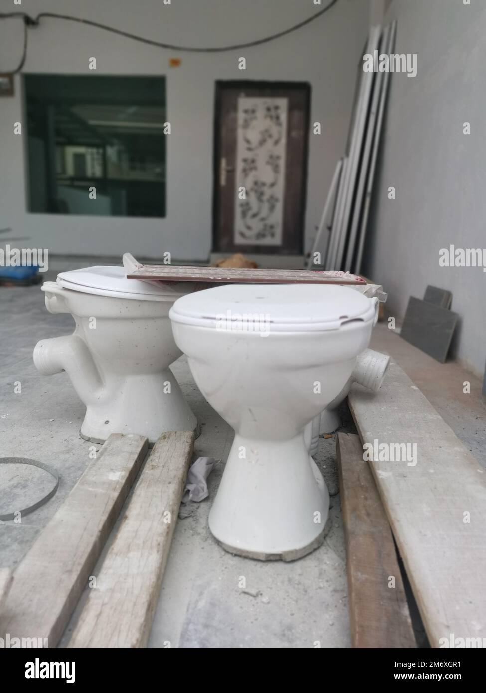 white ceramic toilet seat with slid Stock Photo Alamy