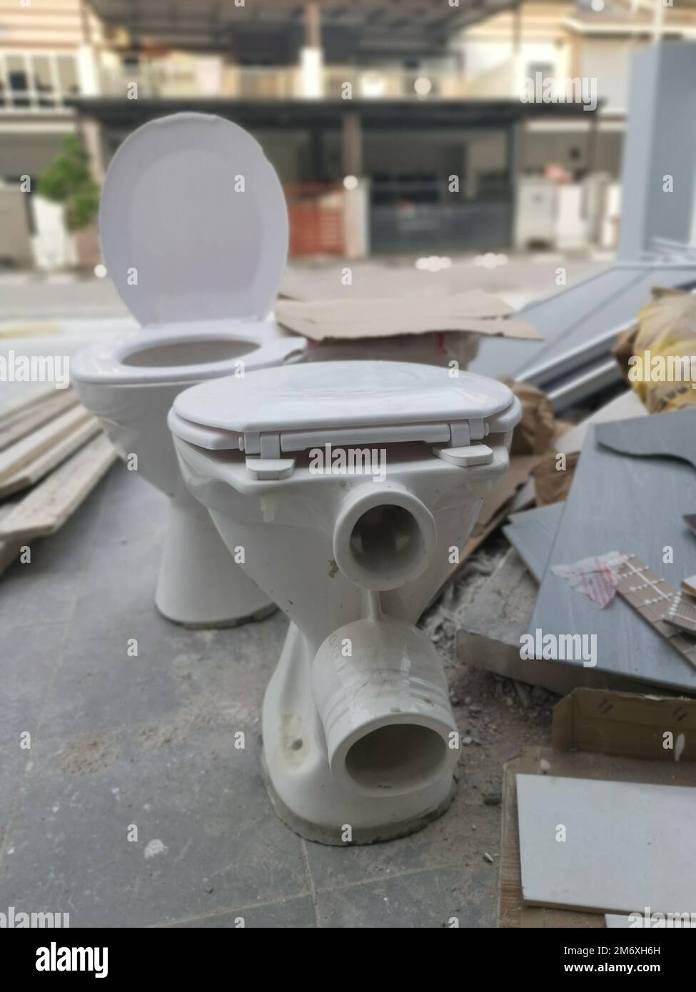 white ceramic toilet seat with slid Stock Photo Alamy