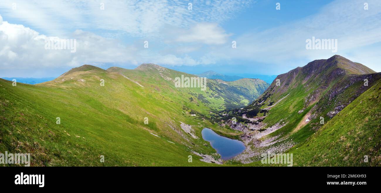 Alpine lake Brebeneckul on summer mountain ravine (Ukraine, Chornogora Ridge, Carpathian Mountains). Stock Photo