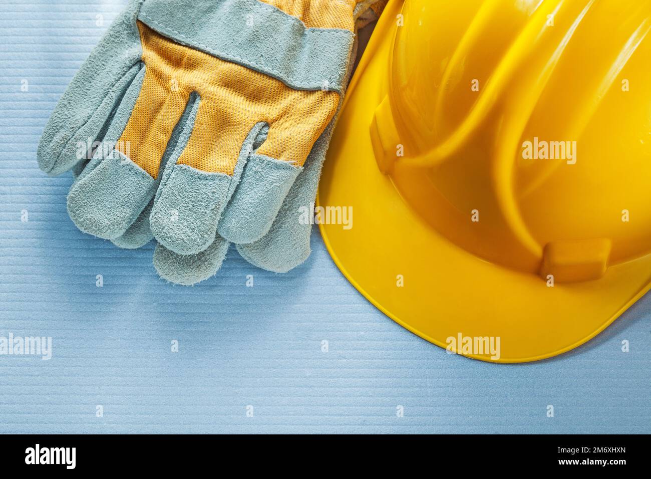 Construction hard hat protective gloves. Stock Photo