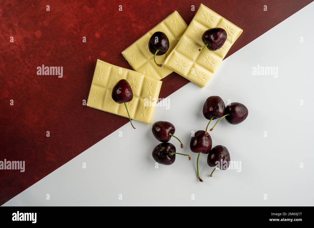 Flat lay view of English Morello Cherries and white chocolate Stock