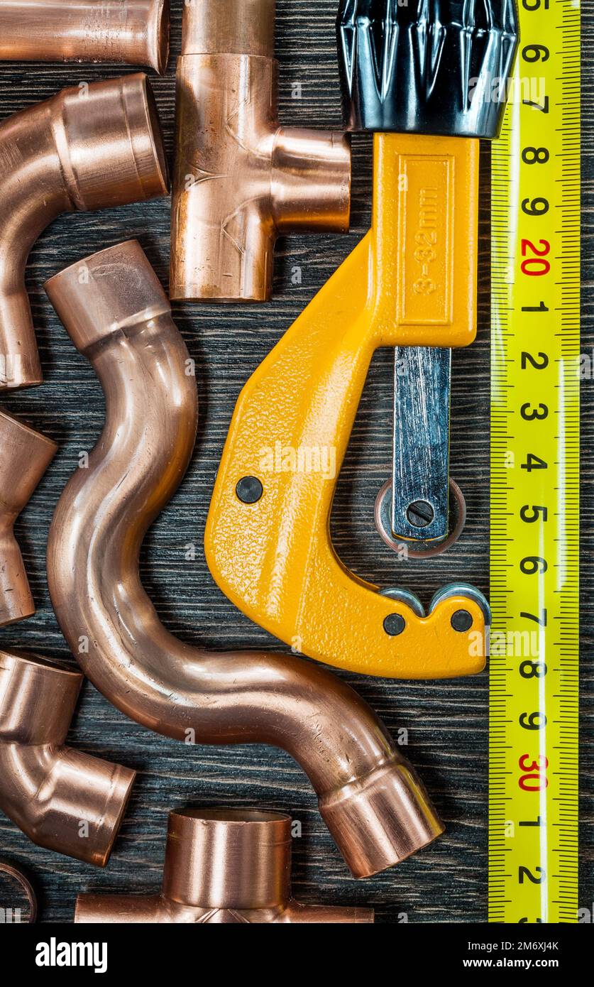 Copper water pipes tape measure pipe scissors Stock Photo Alamy