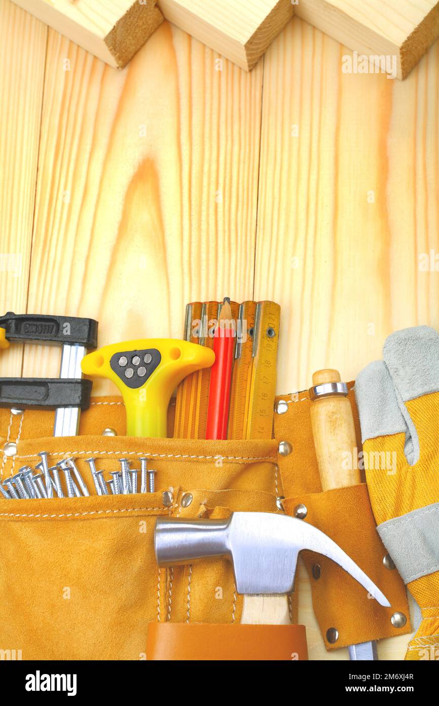 construction tools in belt on wooden boards Stock Photo