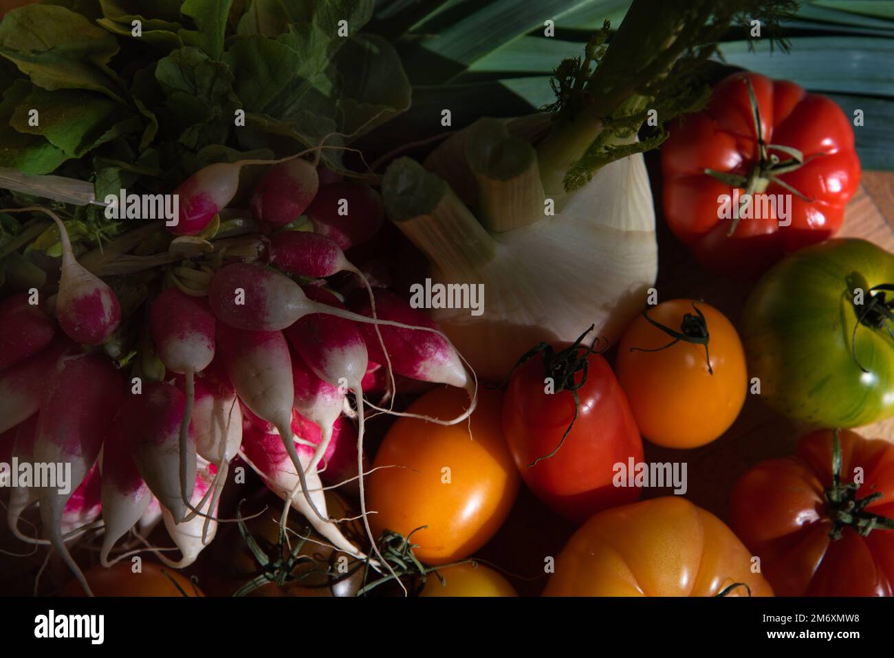 Different colorful organic vegetables from the local farmer market on wooden table. Closeup. Stock Photo