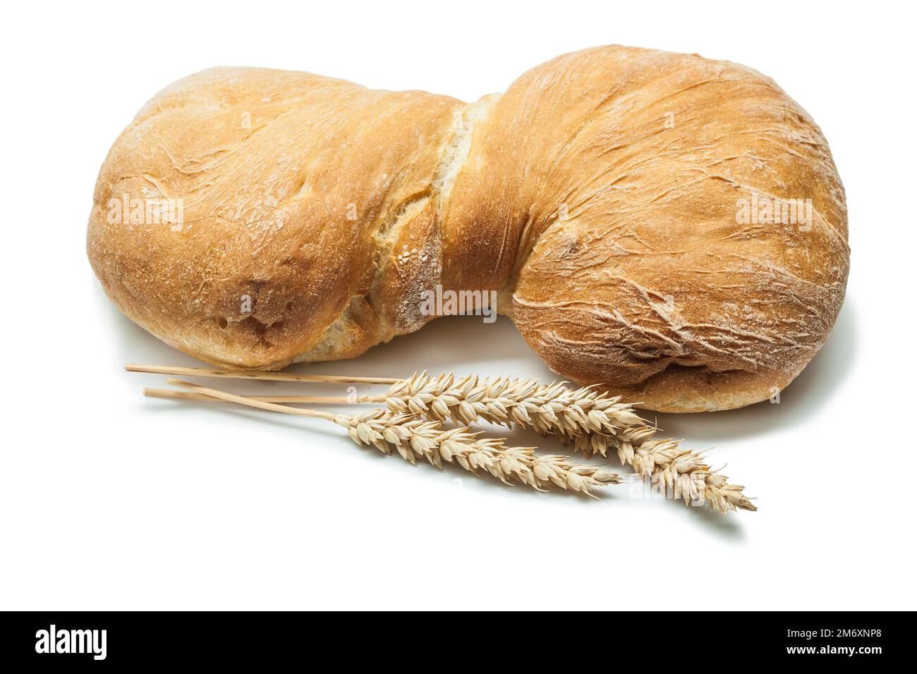 loaf of sweet bread and wheat ears isolated on white Stock Photo - Alamy