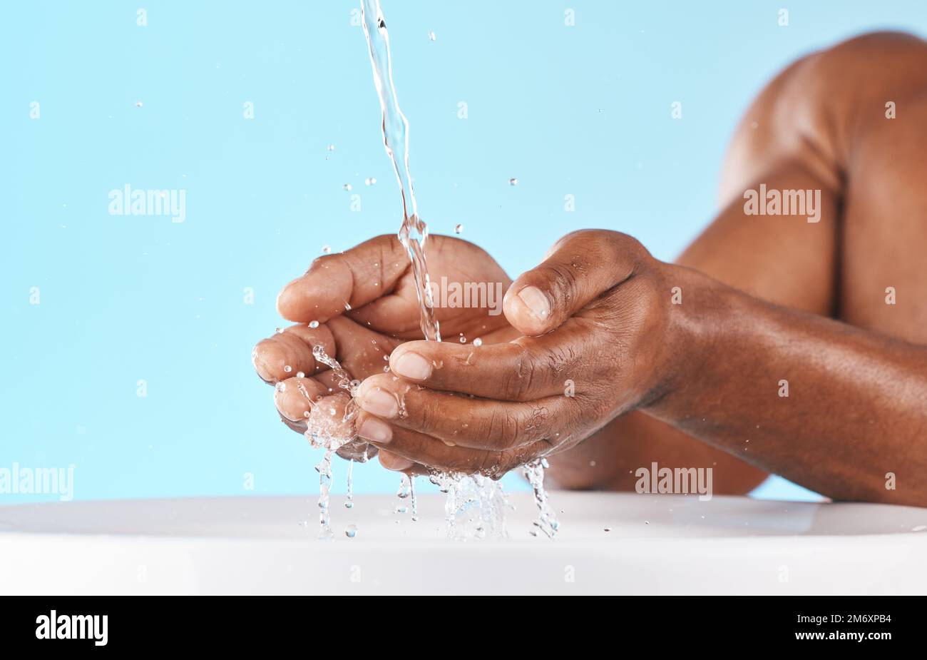 Water splash, hands and cleaning with beauty and black man, hygiene