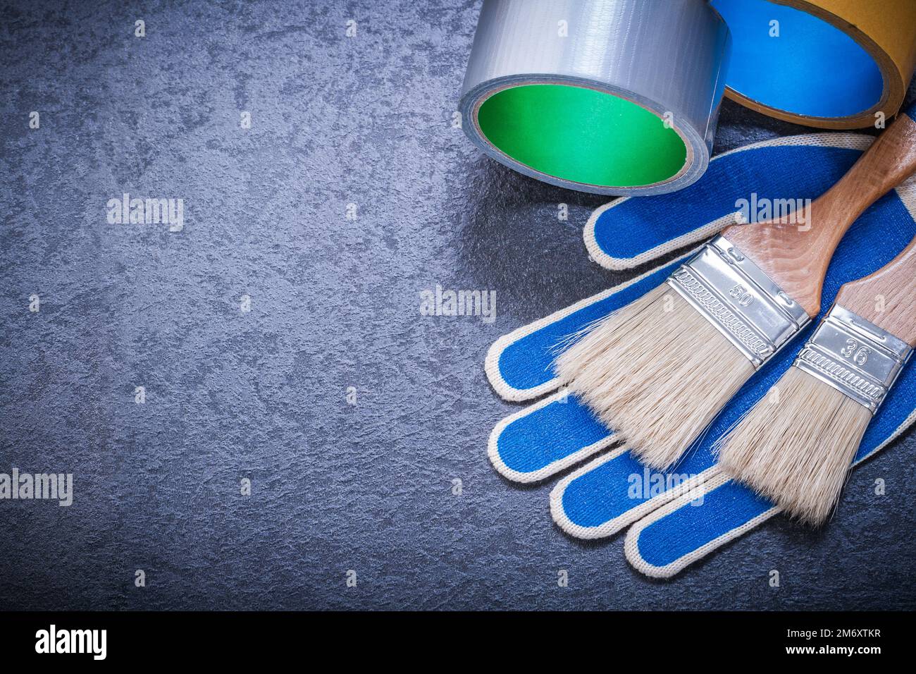 Composition of duct tape paint brushes safety gloves construction