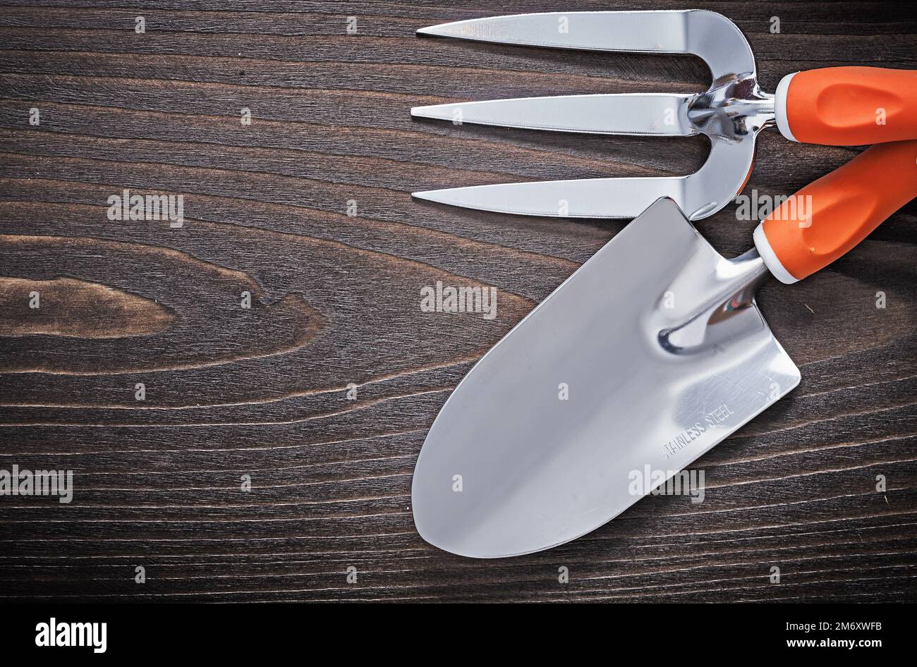 Hand metal spade and trowel fork with handles on vintage hardwood