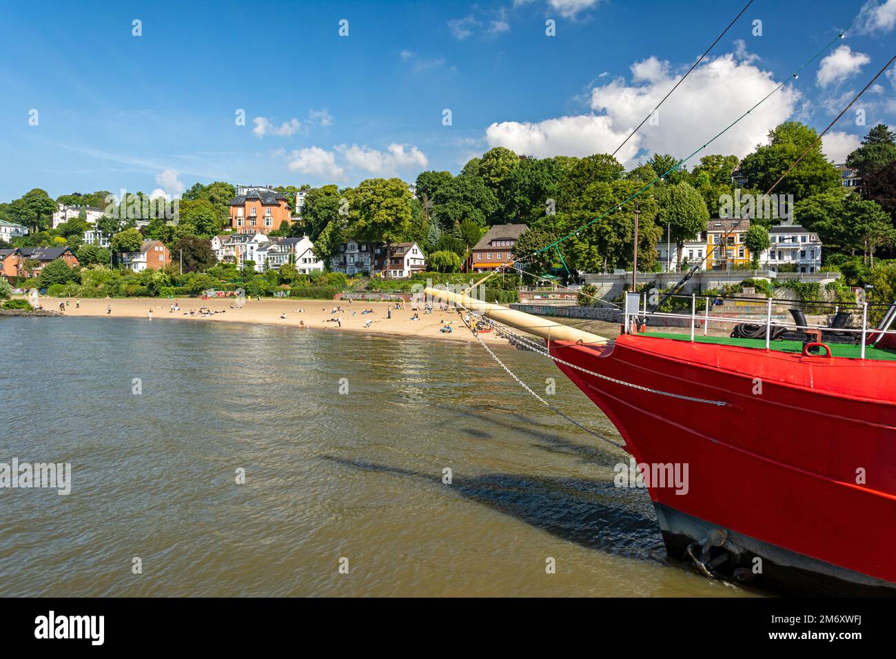 Historic boat and city beach at the waterfront of the Elbe River in ...