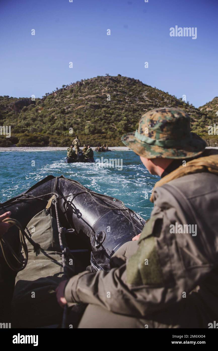 U.S. Marine Corps Cpl. Michael Earl, from Woodbridge, Virginia assigned to Task Force 61/2, participates in an amphibious training evolution with the Hellenic Special Forces during exercise Alexander the Great 22, Greece, May 9, 2022. Alexander the Great 22 strengthens interoperability and force readiness between the U.S., Greece, and Allied nations, enhancing strategic defense and partnership while promoting security and stability in the region. Stock Photo