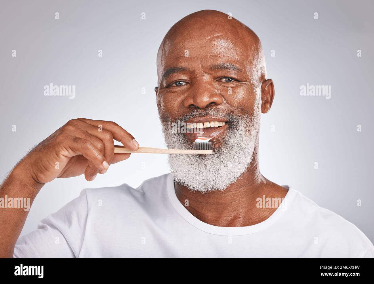 Portrait, black man and brushing teeth with toothbrush for dental wellness, healthy lifestyle or cleaning cosmetics in Nigeria. Happy male model, oral Stock Photo