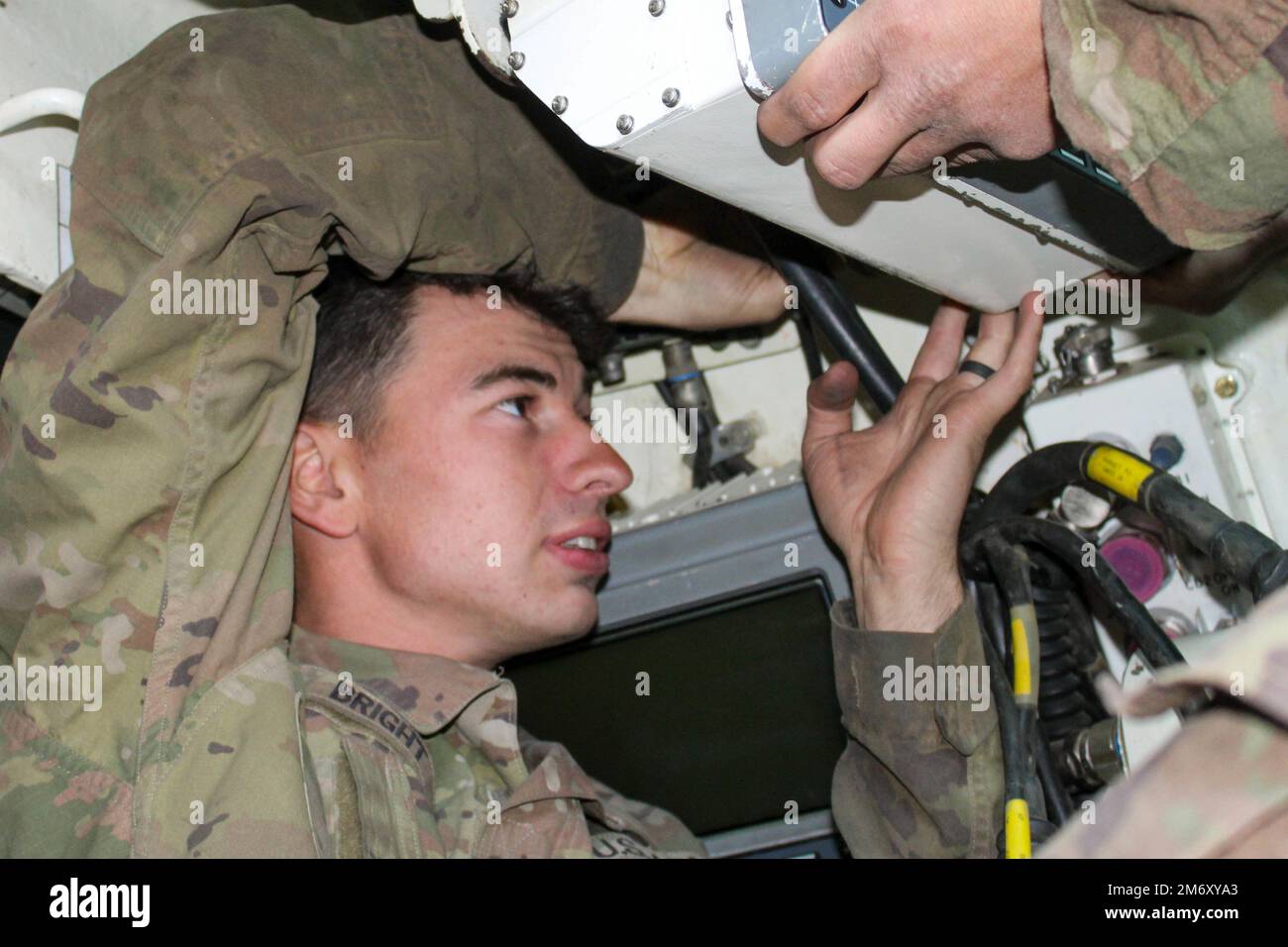 U.S. Army Pfc. Jacob Bright, a Bradley Fighting Vehicle Maintainer ...