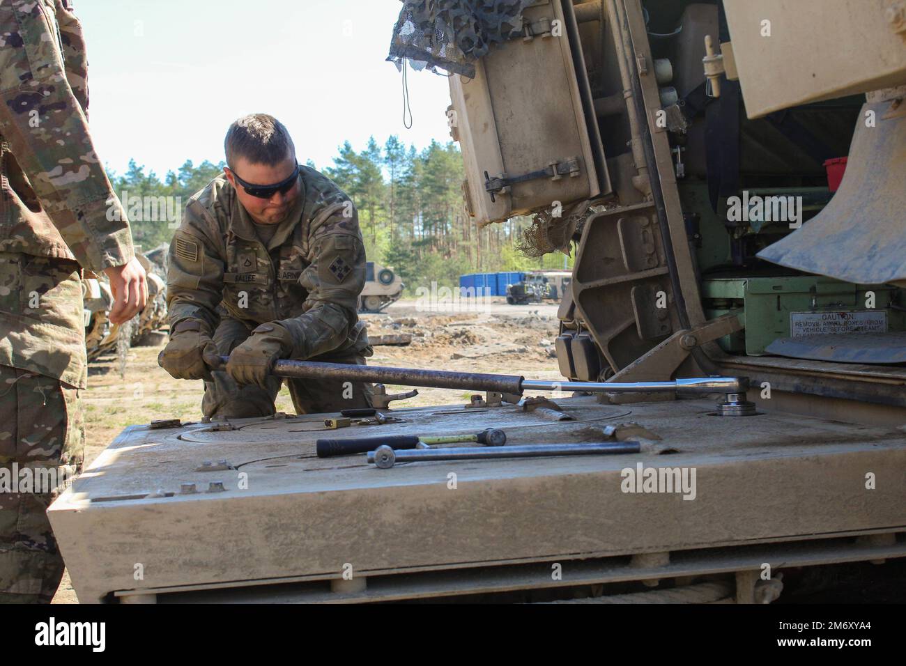 Special Group Soldier Holds A Jack To Open The Doors Stock Photo