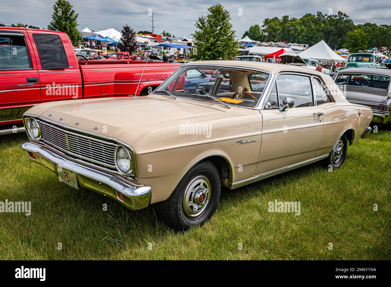 Iola, WI - July 07, 2022: High perspective front corner view of a 1966 Ford Falcon Futura Sports Coupe at a local car show. Stock Photo