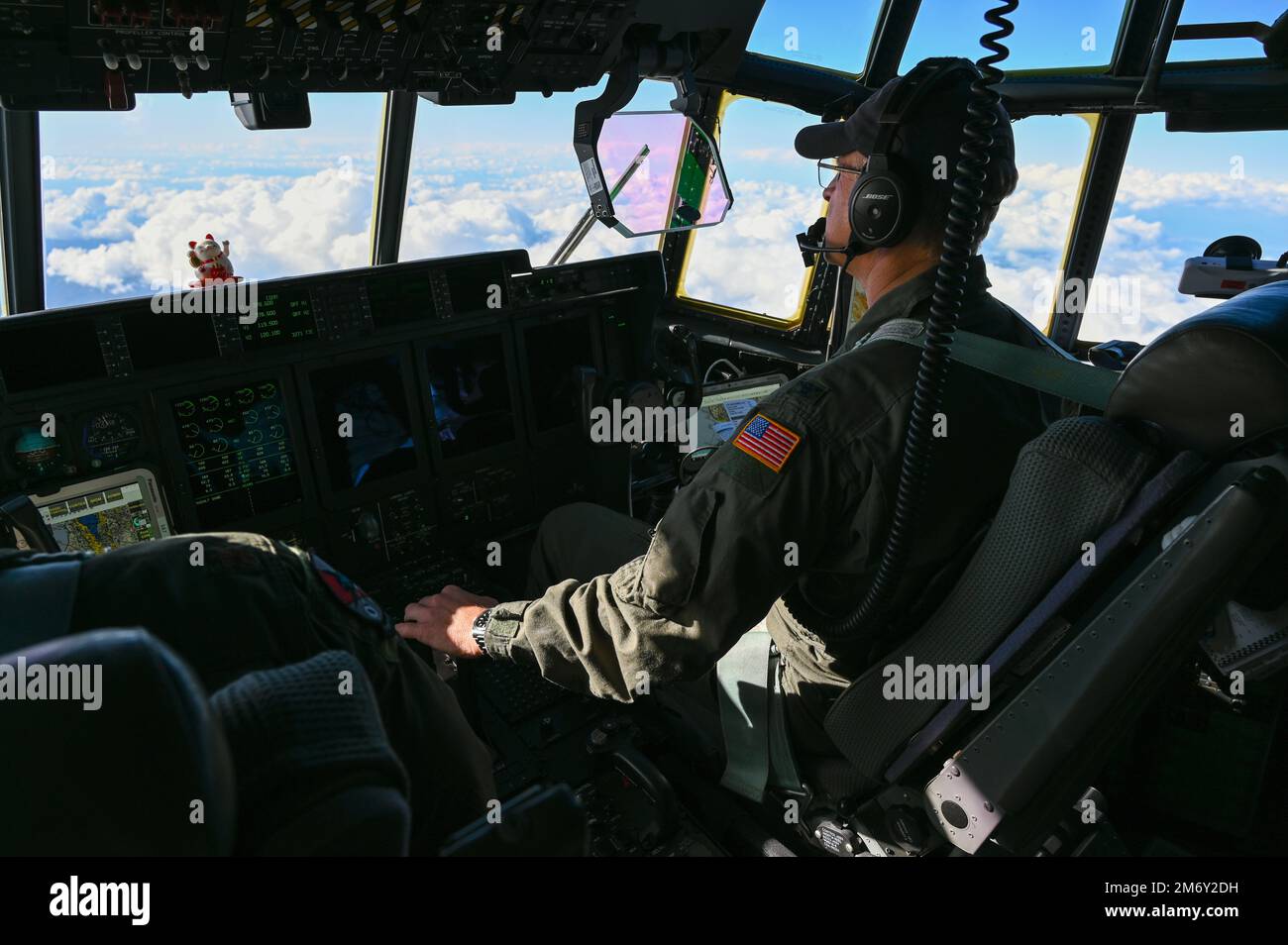 U.S. Air Force Col. Jeffrey Waldman, previous commander of the 129th Rescue Wing, copilots a flight in a HC-130J Combat King II to Socorro Island off the coast of Cabo San Lucas, Mexico, May 9, 2022. This was Waldman’s last rescue mission before he retires. (Air National Guard photo by Airman Serena Smith) (This image has been altered to enhance the subject) Stock Photo