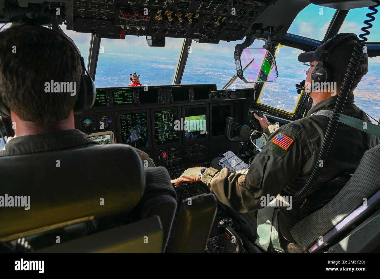 U.S. Air Force Maj. Evan Dineen assigned to the 130th Rescue Squadron and Col. Jeffrey Waldman assigned to the 129th Rescue Wing fly a HC-130J Combat King II to Socorro Island off the coast of Cabo San Lucas, Mexico, May 9, 2022. The crew picked up four pararescuemen from the 131st Rescue Squadron who rescued and medically treated passengers on board a sinking vessel three days prior. (Air National Guard photo by Airman Serena Smith) (This image has been altered to enhance the subject) Stock Photo
