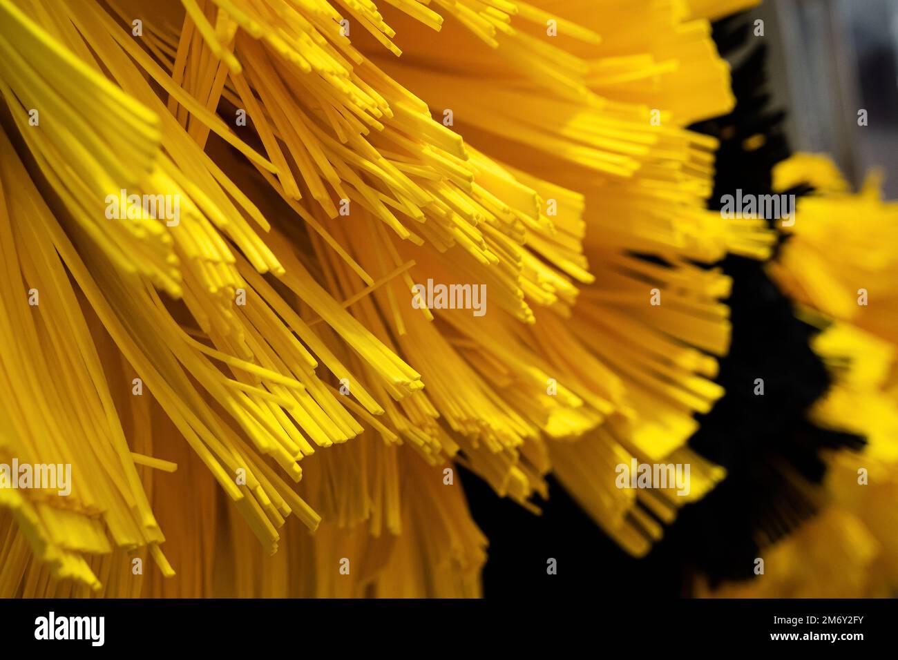 front view closeup detail of black and yellow automatic car wash system