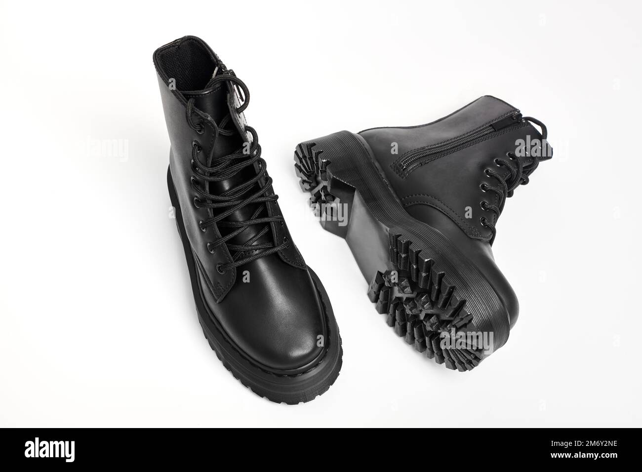 Black women combat boots on high heel platform with lug soles lying on  isolated white background. Military stylish high heel platform combat boots  for Stock Photo - Alamy