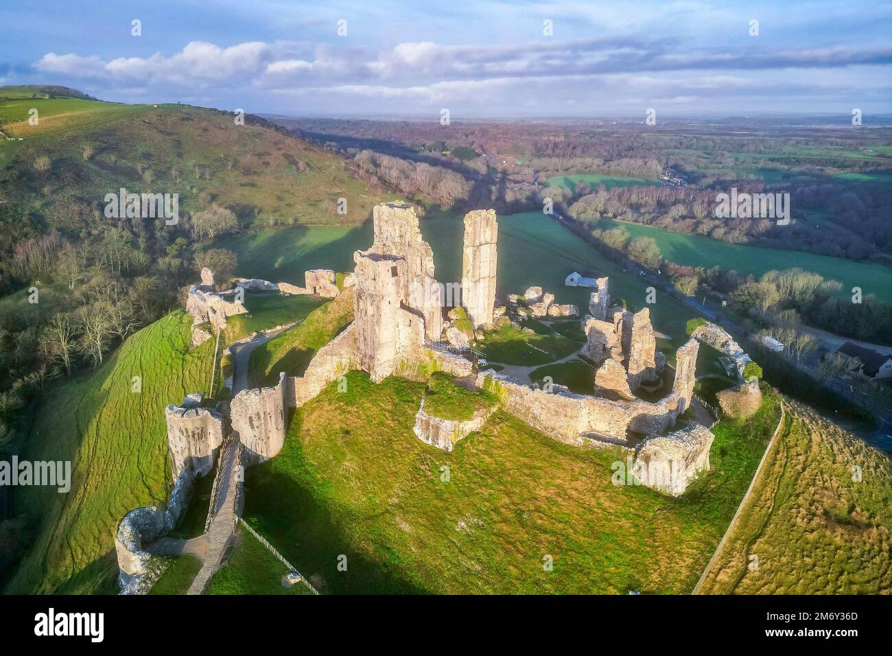 Corfe Castle, Dorset, UK.  6th January 2023.  Early morning sunshine at Corfe Castle in Dorset shortly after sunrise.  Picture Credit: Graham Hunt/Alamy Live News Stock Photo