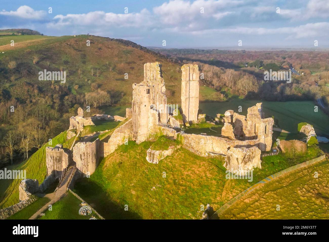 Corfe Castle, Dorset, UK.  6th January 2023.  Early morning sunshine at Corfe Castle in Dorset shortly after sunrise.  Picture Credit: Graham Hunt/Alamy Live News Stock Photo