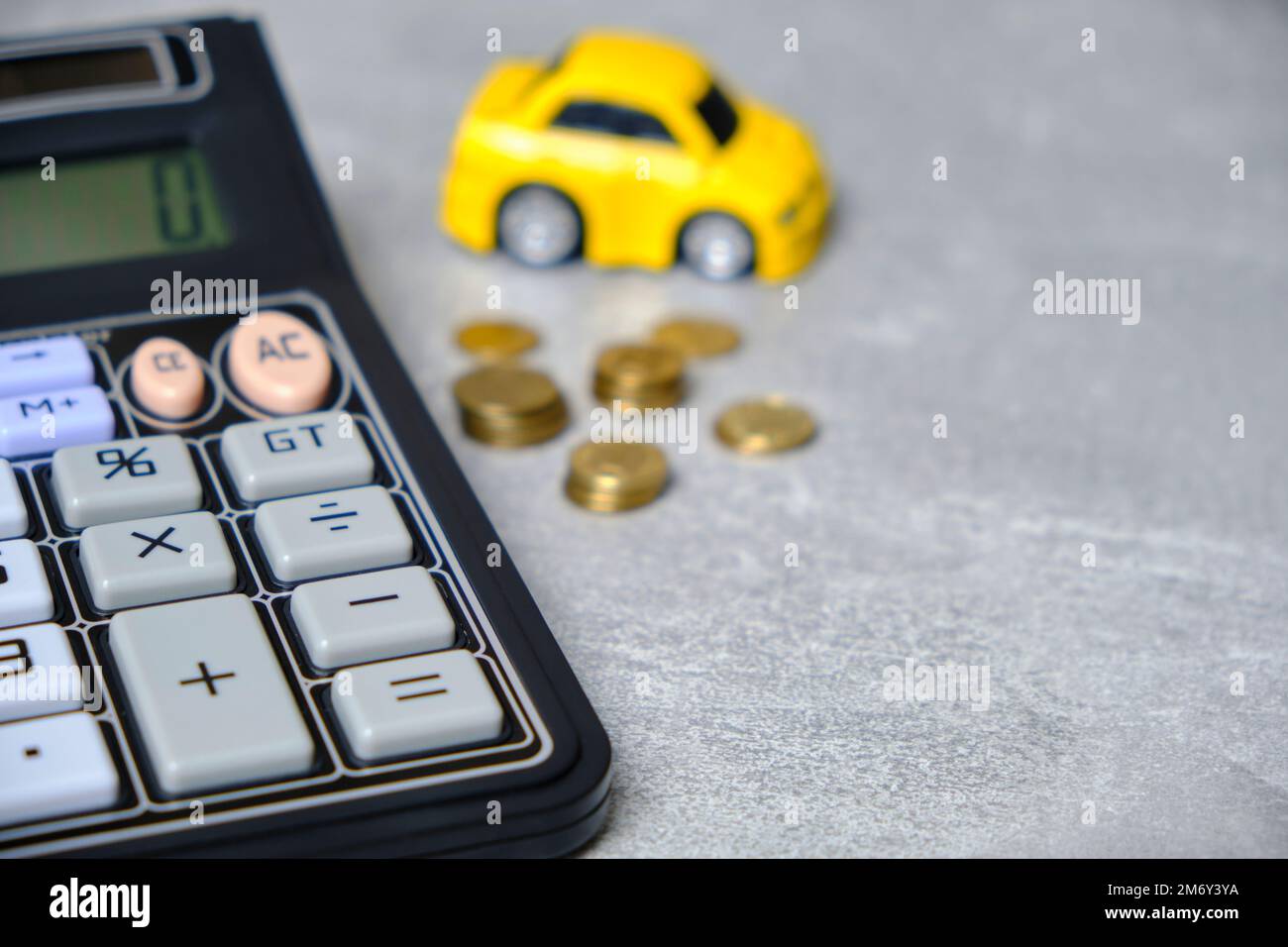 Calculator, coins and car, concept buying car Stock Photo - Alamy