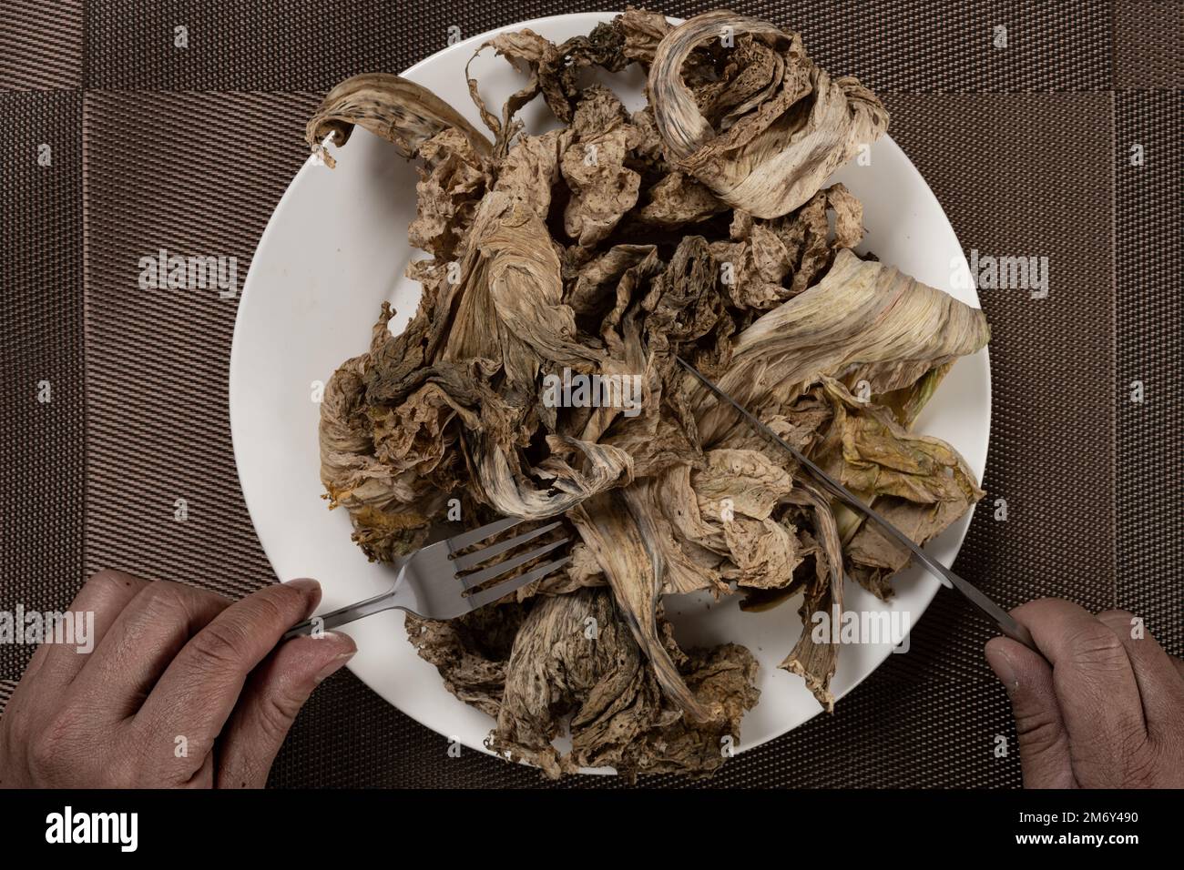 man eating moldy vegetable concept of lack of food Stock Photo Alamy