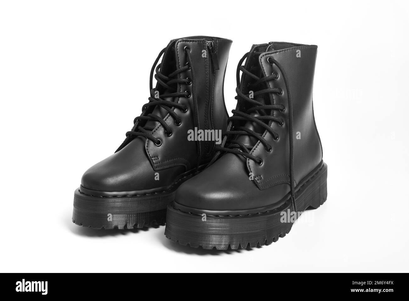 Black women combat boots on high heel platform with lug soles on