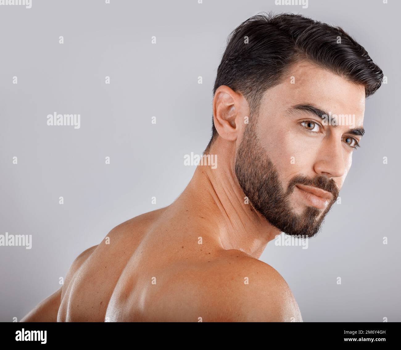 Skincare, health and man in a studio for a hygiene, wellness and natural cosmetic face routine. Beauty, cosmetics and male model from Dubai with self Stock Photo