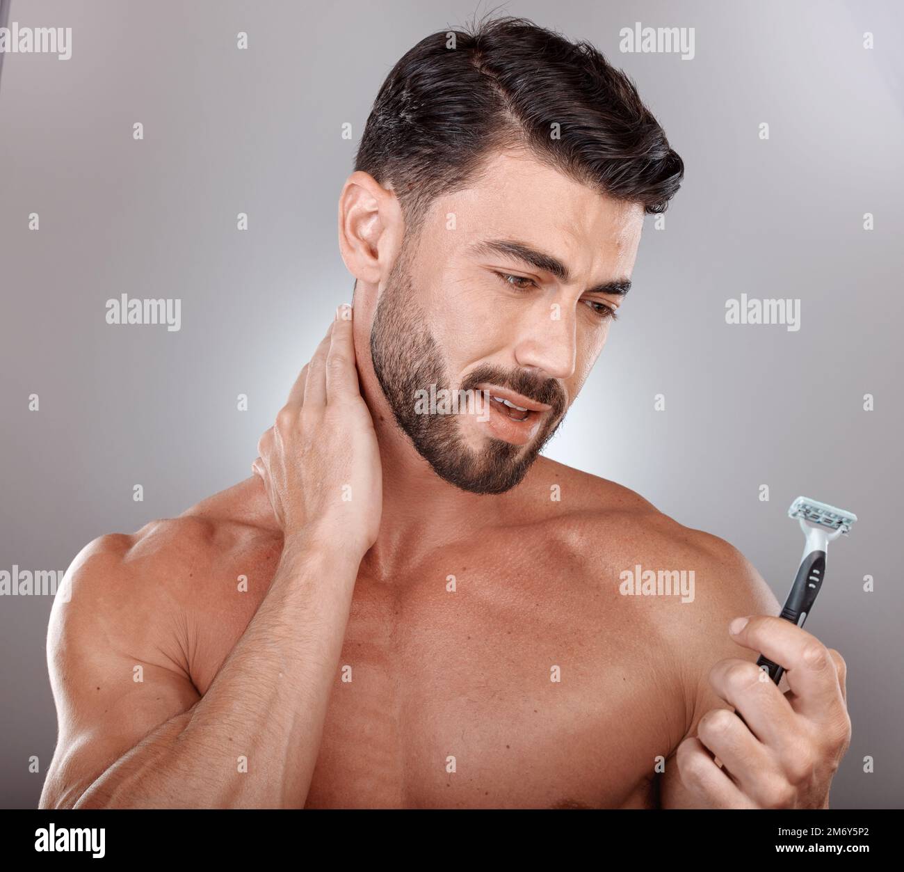 Razor, beauty or man in studio to shave beard in grooming marketing razor hair care products. Self care, studio background or healthy male model Stock Photo