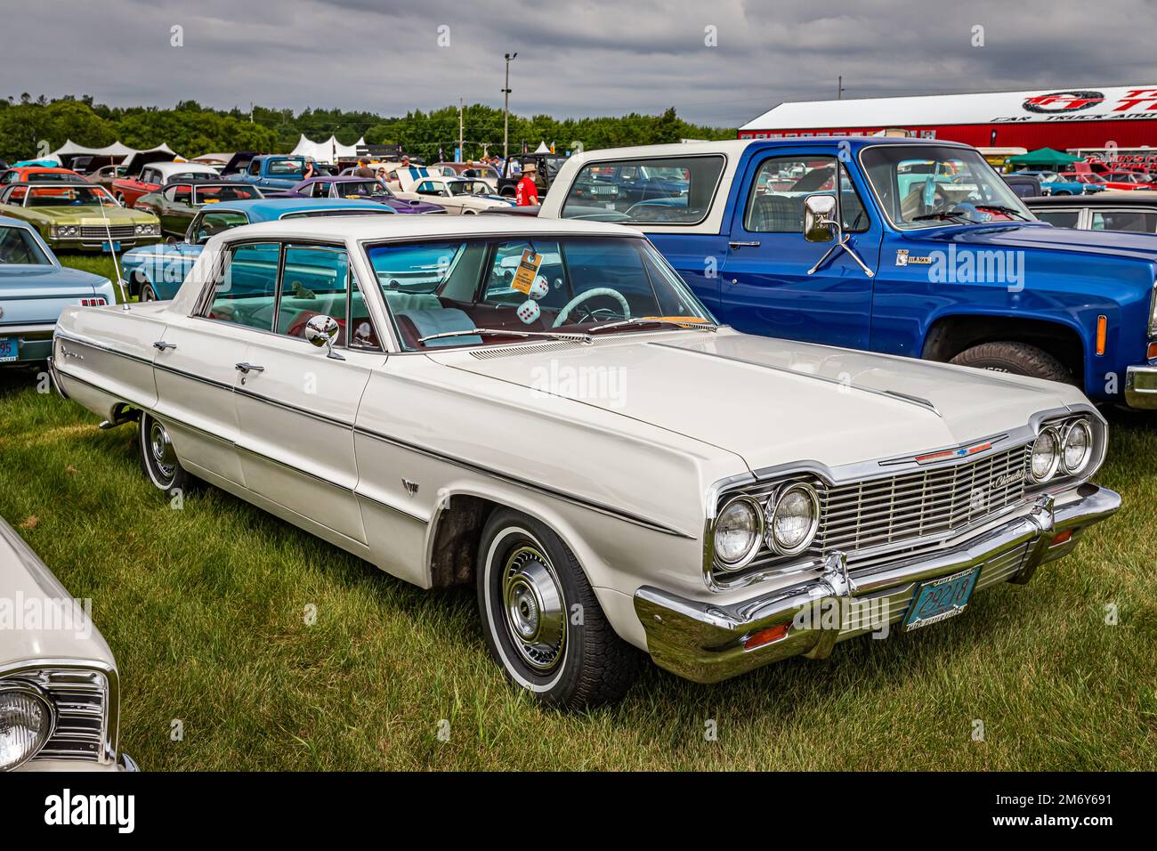 Iola, WI - July 07, 2022: High perspective front corner view of a 1964 Chevrolet Impala 4 Door Sedan at a local car show. Stock Photo