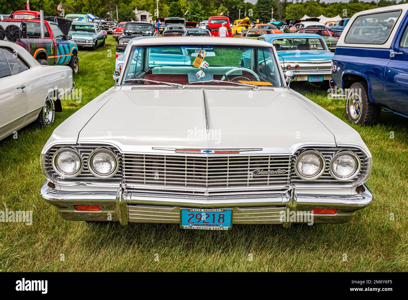 Iola, WI - July 07, 2022: High perspective front view of a 1964 Chevrolet Impala 4 Door Sedan at a local car show. Stock Photo
