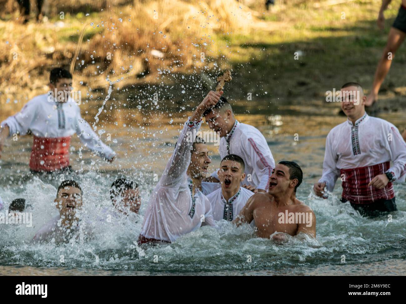 Bulgaria Elhovo January 6 2023: Young men every year dash into icy waters  of a local rivers, Bulgarian Orthodox church marks St. Jordan's Day  (Epiphany). It falls on the twelfth day after